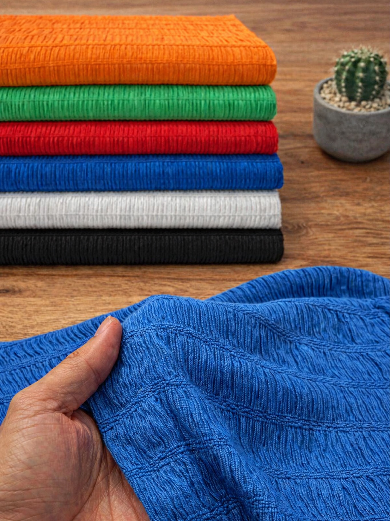 Folded UNICOTEXTEIS knit fabrics in a full colour range